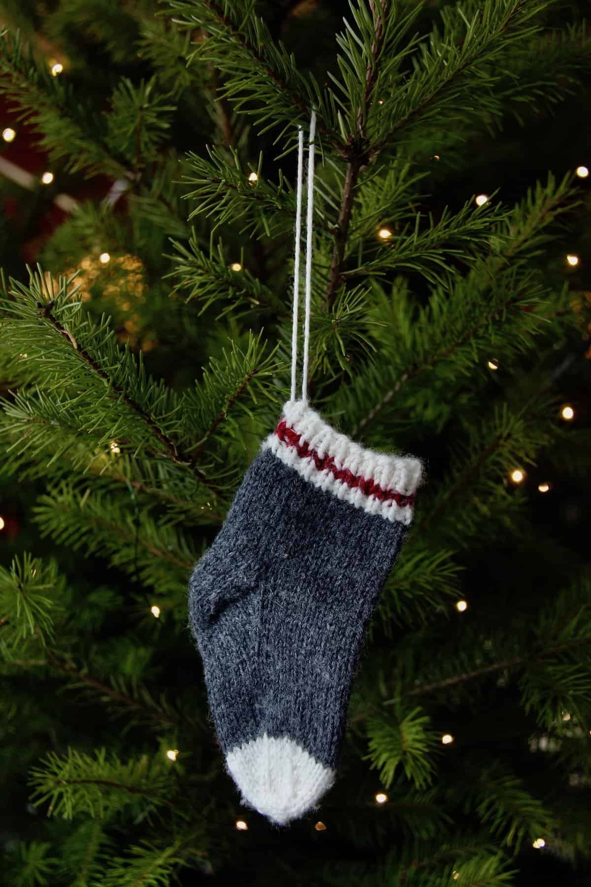 Little lumberjack sock stocking ornaments to celebrate baby's first christmas #babysfirstchristmas #babystocking #babychristmas #stockingornament