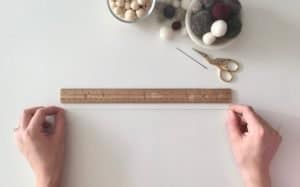 measuring out string for felt ball ornaments