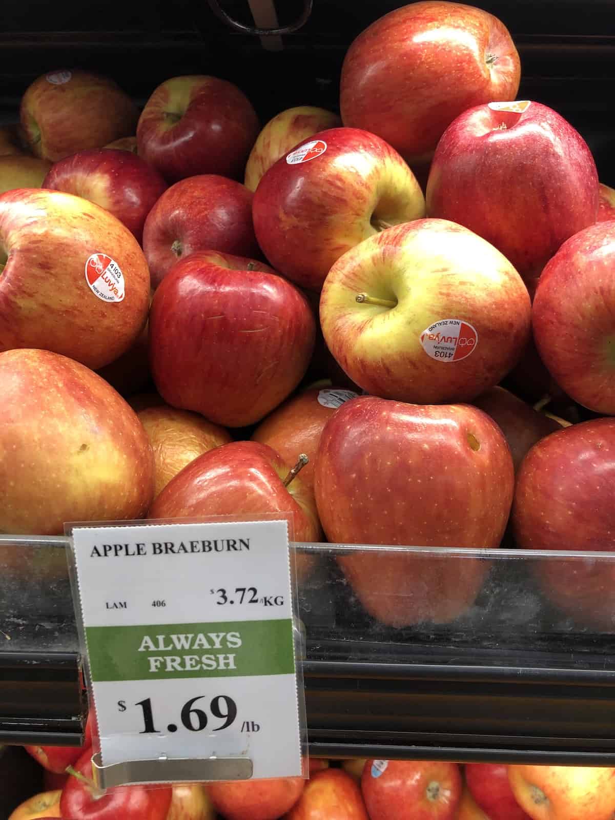Grocery store self of red braeburn apples