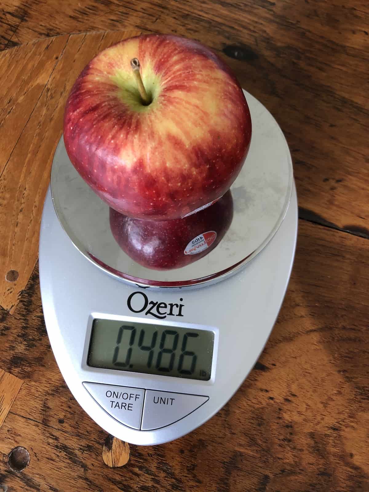One braeburn apple on kitchen scale