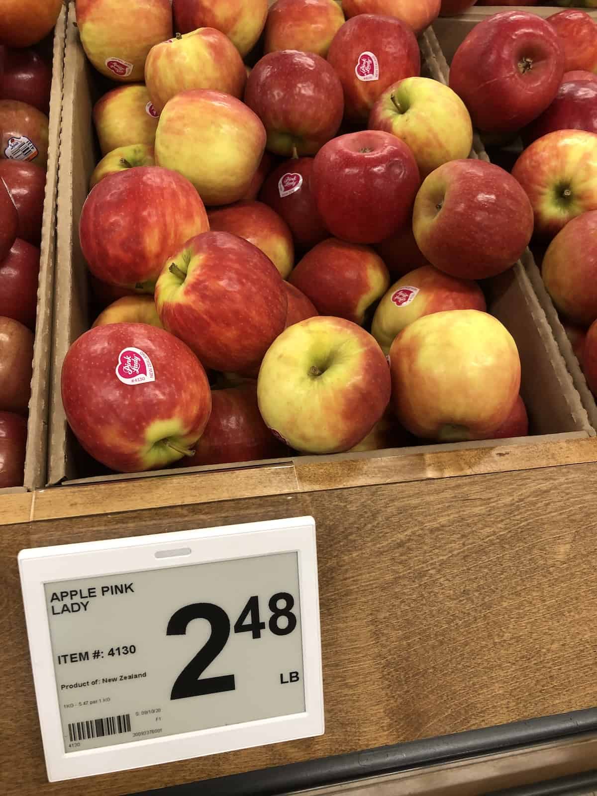Price tag of $2. 48 per lb for pink lady apples at grocery store