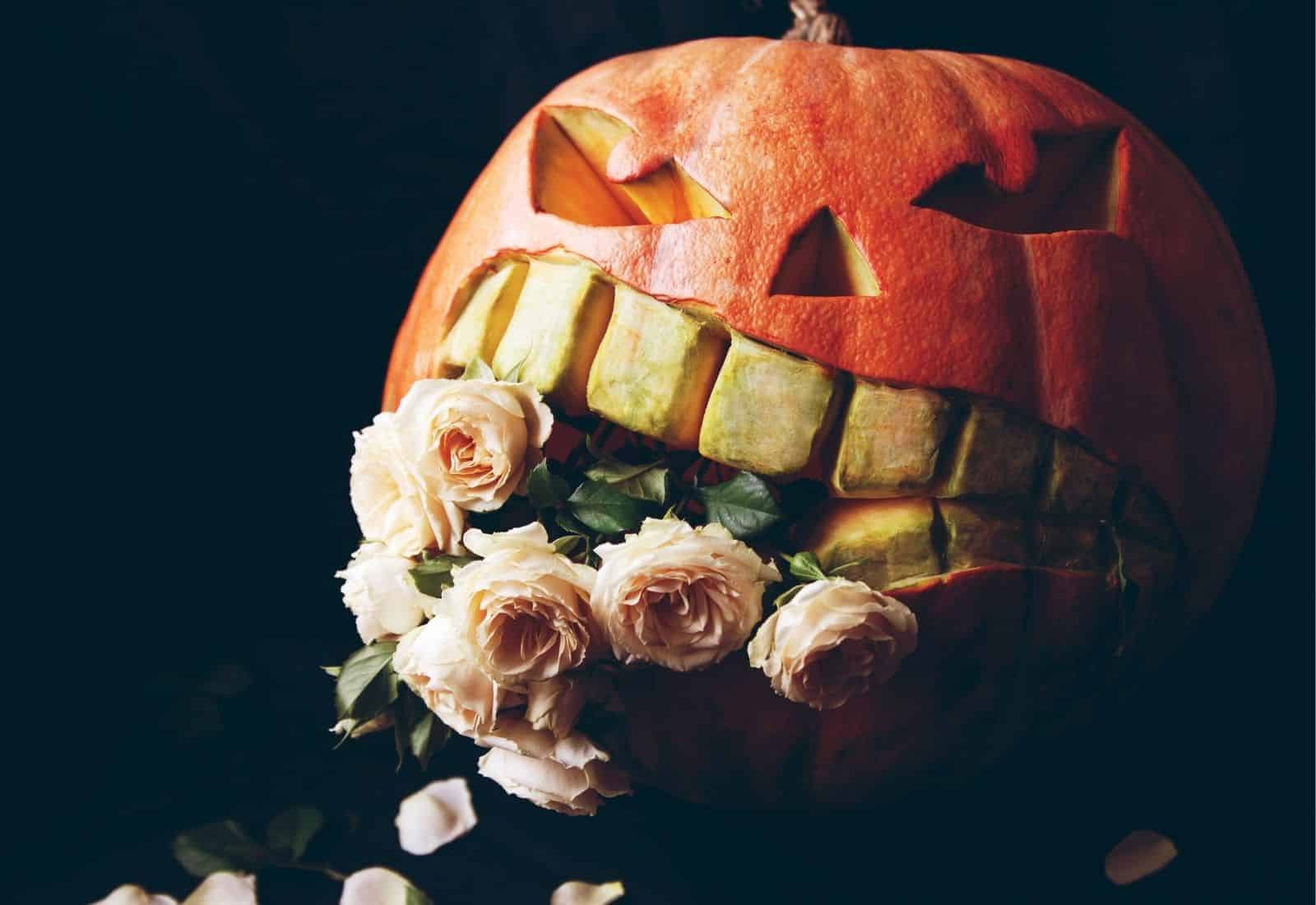Pumpkin with big teeth eating flowers