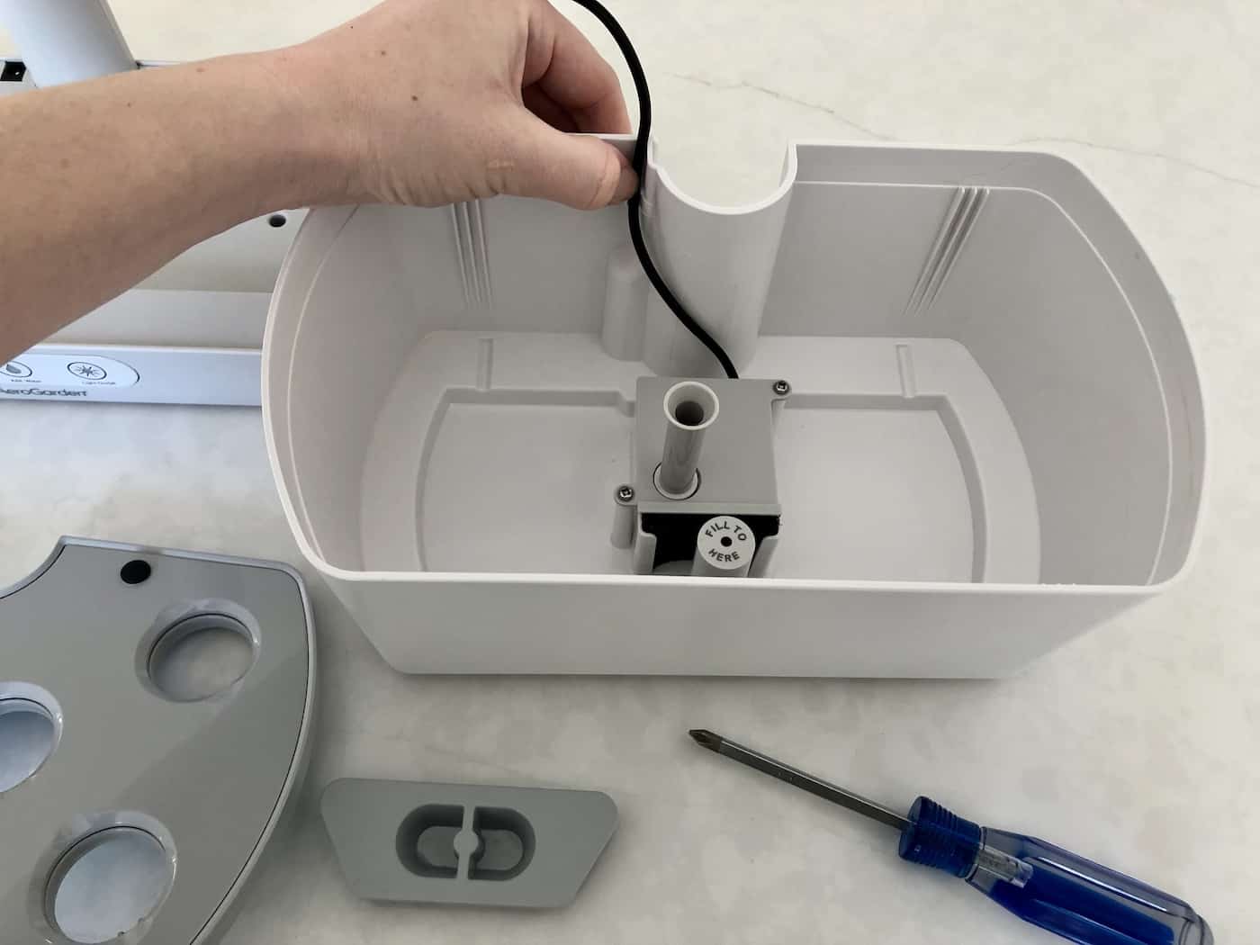 Reattaching pump cord in water bowl
